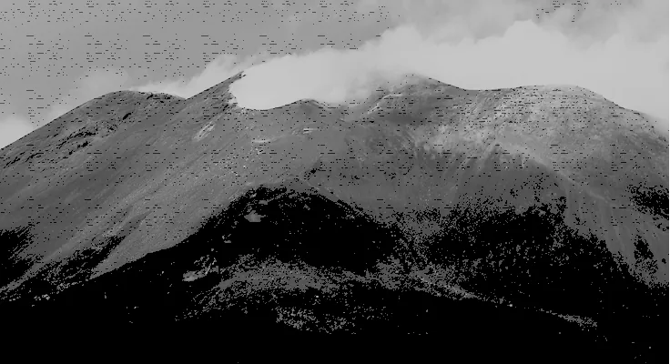 A mountain range under cloud